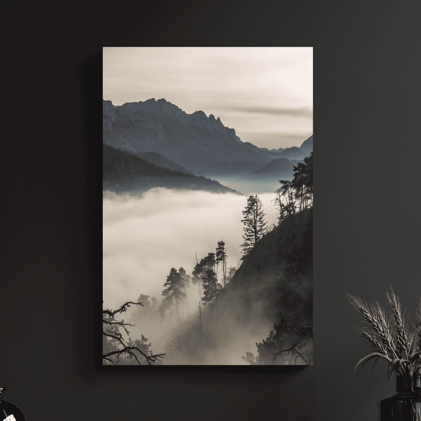 a black and white photo of a foggy mountain