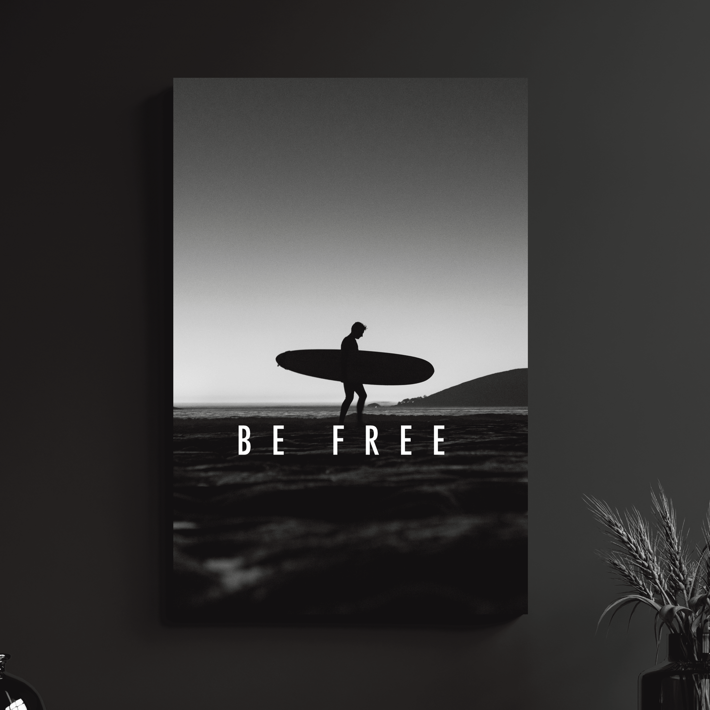 a black and white photo of a person holding a surfboard